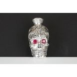 Unusual skull shaped lidded flask with glass eyes