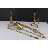 Brass Three Piece Fireside Companion Set together with a Pair of Brass Fire Dogs