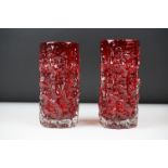 Two Whitefriars Ruby Red cylindrical textured Bark vases, pattern 9689, approx 15cm and 15.5cm