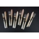 A silver plated fish knife and fork set.