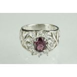 Silver and CZ dress ring with central amethyst panel