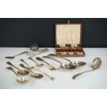 A small collection of silver and silver plated cutlery to include a cased coffee bean spoon set.