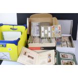 A large box of mixed ephemera to include tea cards, cigarette cards, ration books, vintage train