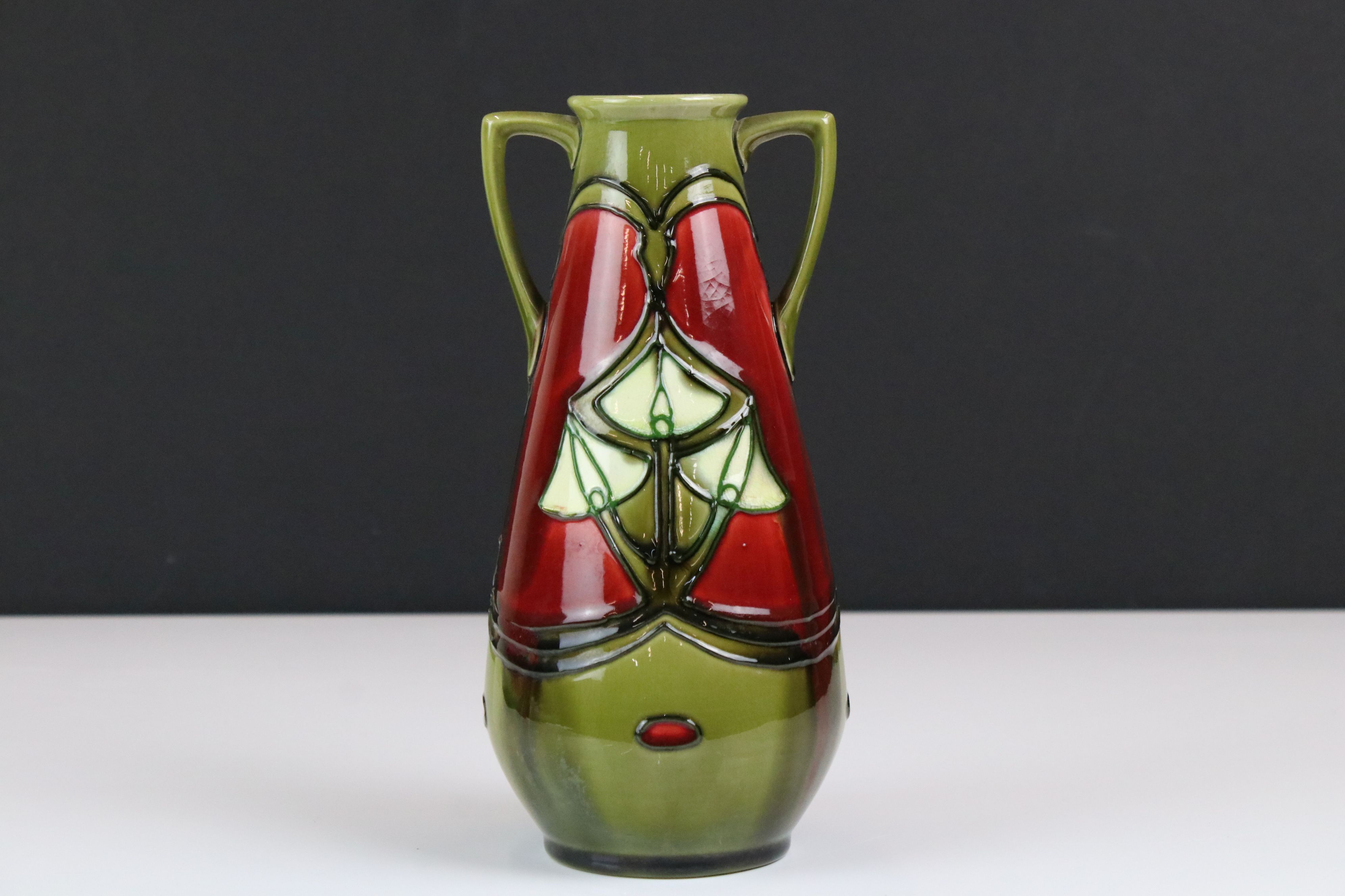 Minton Secessionist Red and Green Glazed Twin Handled Vase, marked No. 12 to base, 21cm high