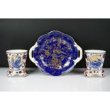 Pair of Coalport Imari vases of tapering form, each raised on three supports, decorated with