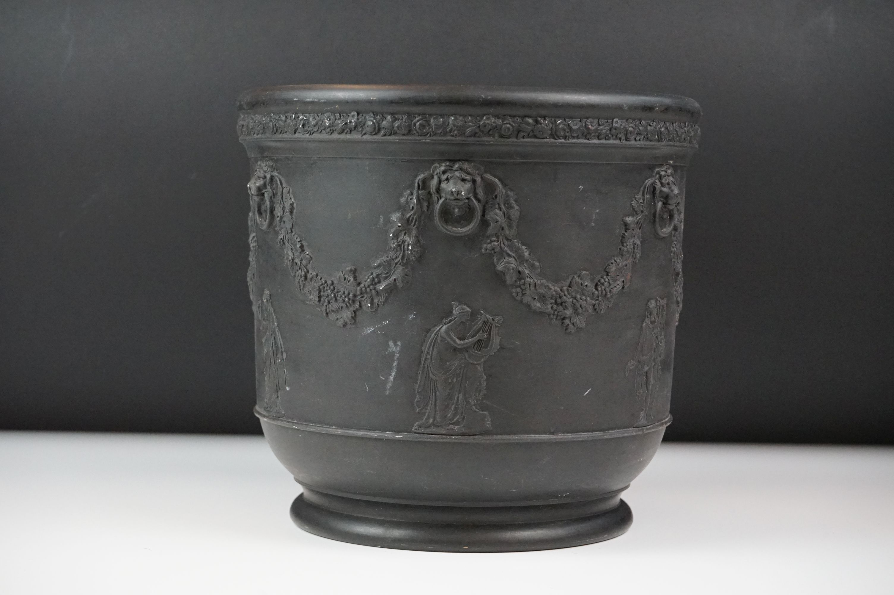 Wedgwood black basalt jardinière, sprigged with muses and festooned with vines, impressed Wedgwood