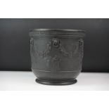 Wedgwood black basalt jardinière, sprigged with muses and festooned with vines, impressed Wedgwood