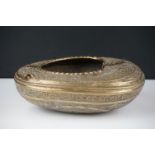19th Century Persian brass Kashkul 'begging bowl' heavily embossed and chased with floral and