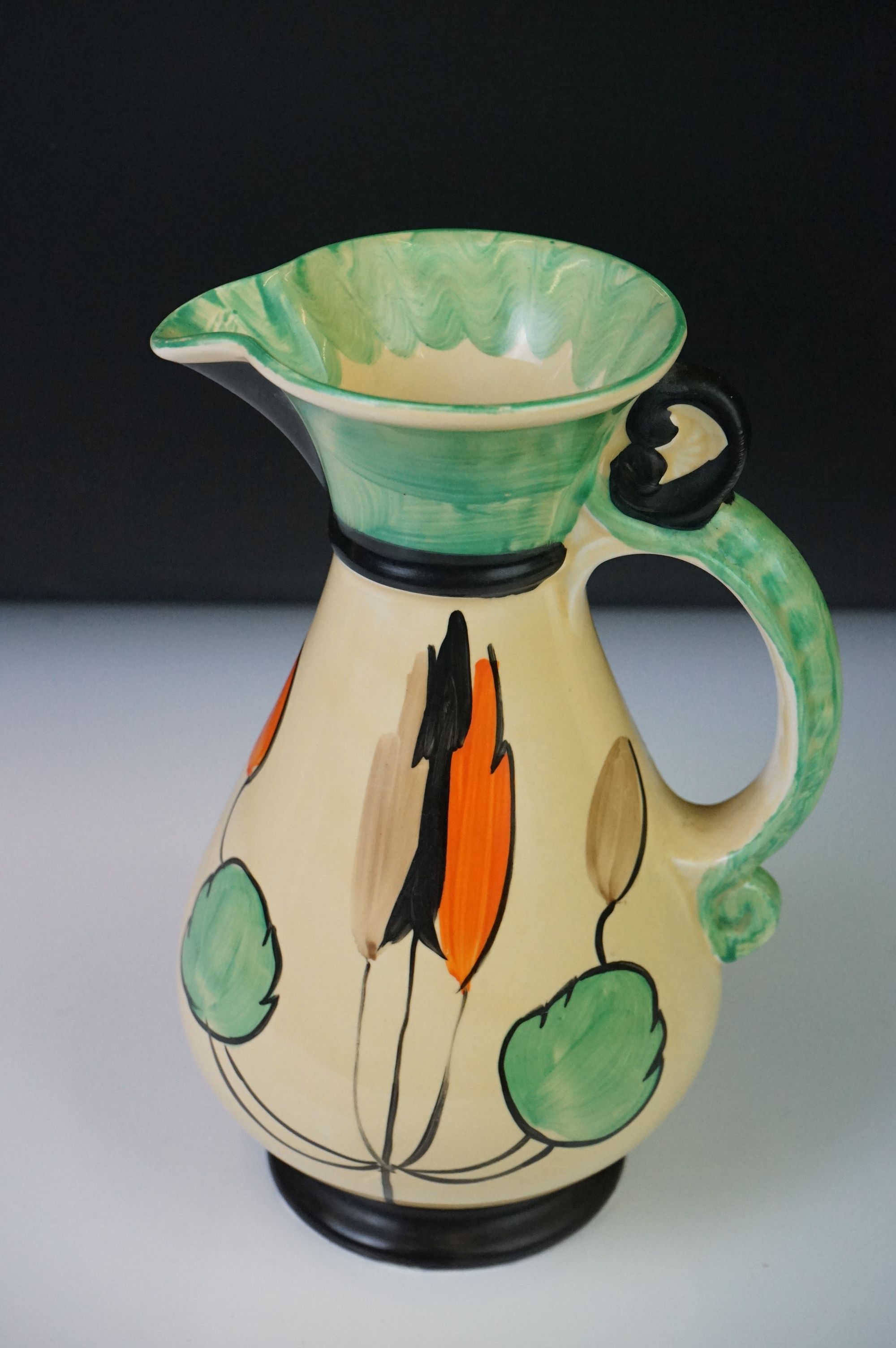 Four Myott, Son & Co hand painted Art Deco footed jugs, decorated with colourful floral, foliate and - Image 10 of 21