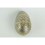 White metal pomander of egg form, punched zig zag decoration, height approx 4cm Provenance: from the