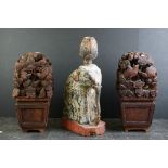 Pair of South East Asian carved wooden flower displays, 32cm high, together with a painted carved