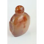 Banded agate carnelian snuff bottle, carved lion mask motifs, height approx 10.5cm Provenance: