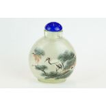 Reverse painted Chinese snuff bottle, depicting a stork on a branch and a mountainous lakeside