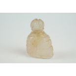 Rose quartz miniature scent bottle of asymmetric form, carved with foliate decoration, height approx