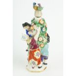 Girl in Swing scent bottle depicting a courting couple amongst a flower bower with another boy and