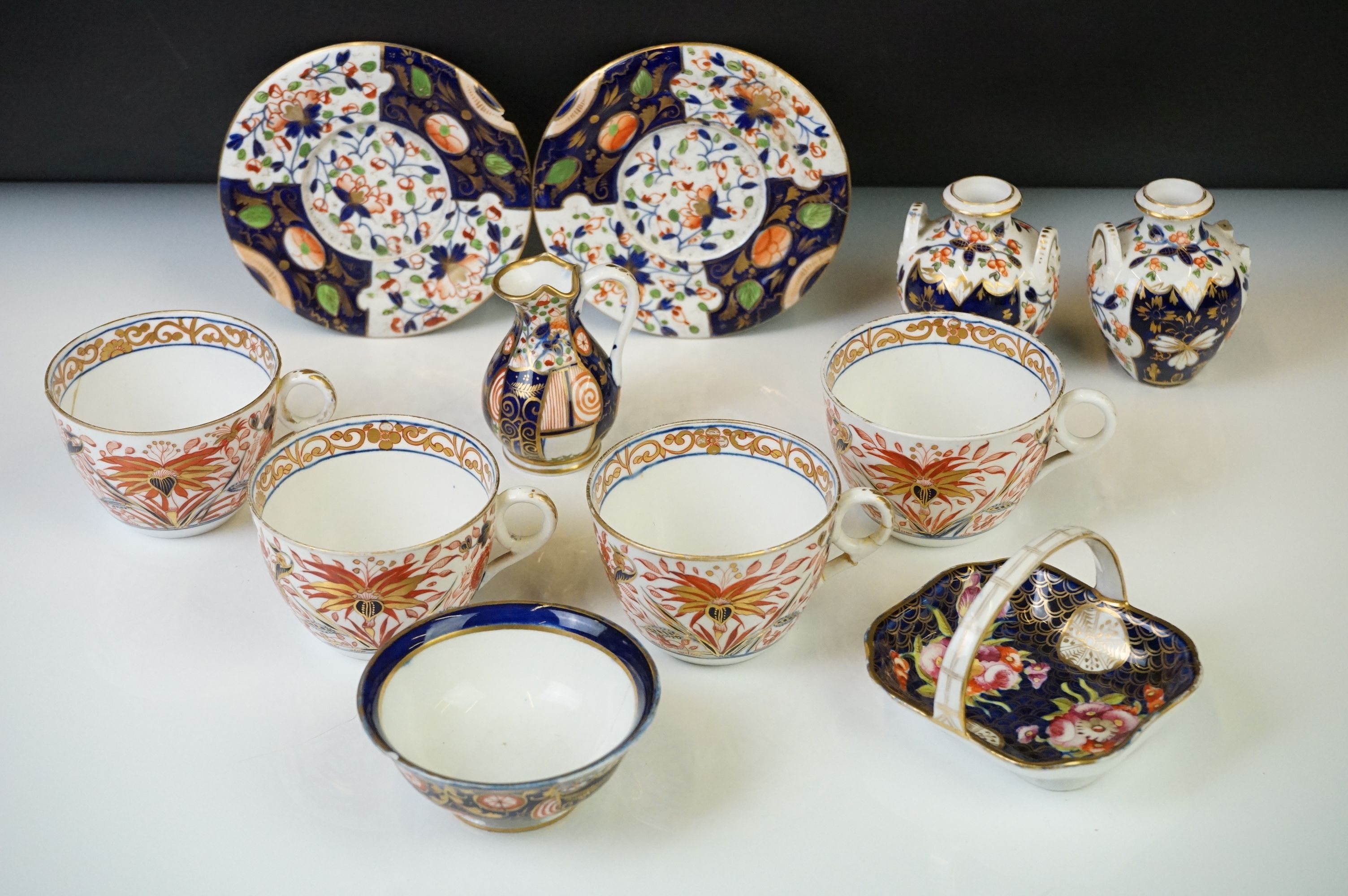 Group of Early 19th Century Crown Derby Imari pattern ceramics, to include two saucers, a pair of