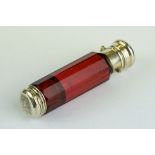 19th century double ended ruby glass scent bottle, the plain polished white metal cap opening with