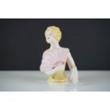 A ceramic Art Deco style pin doll in the form of an Art Deco figure