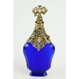 18th century blue glass gilt scent bottle, faceted hourglass body raised on foot, pierced gilt