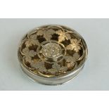 18th century white metal spice box, circular, pierced lid, ivy leaf decoration with rose to