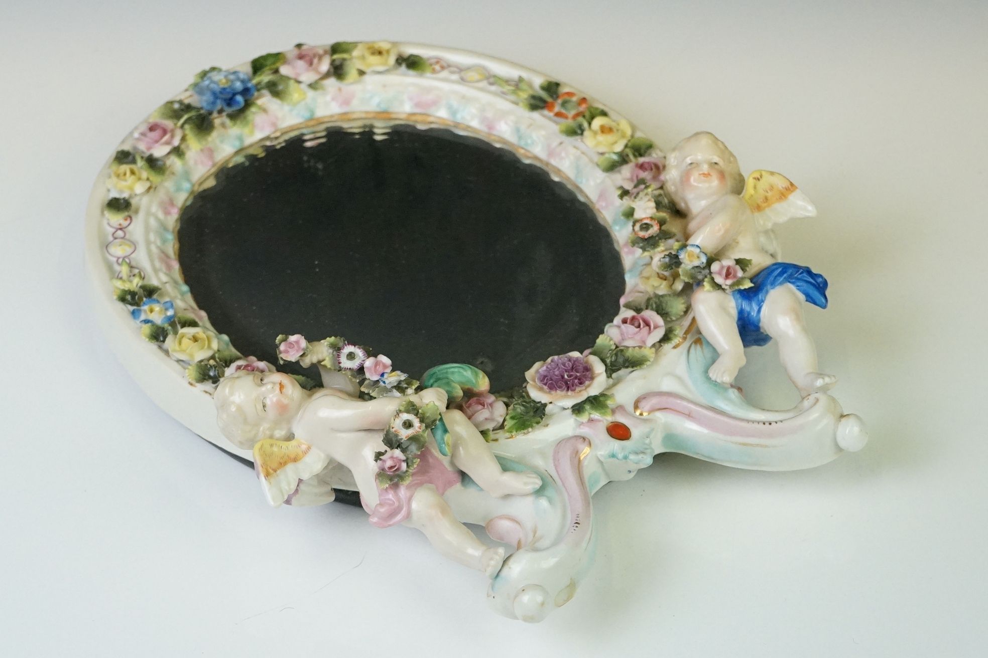 Dresden porcelain dressing table mirror of oval form, with bevel glass surmounted by two cherubs - Image 2 of 7