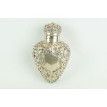 Edwardian silver heart shaped scent bottle, repoussé foliate scroll decoration, blank shield