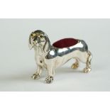 A silver dachshund dog pin cushion