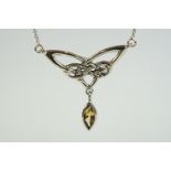 A silver Art Nouveau style necklace with citrine drop