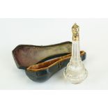 Late 18th century glass scent bottle, tapered faceted form with bulbous base, yellow metal mounts,