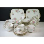 Early 20th Century Hand Painted tea service with floral design on a white ground and gilt rims, to