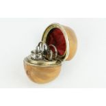 Late 19th century miniature etui contained within a hazlenut, containing miniature scissors,