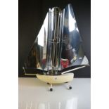 Mid 20th Century heat lamp modelled as a yacht, with an aluminium sail and iron base, measures