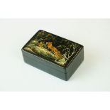A Russian lacquer box, signed Myahchhok (?), depicting a horse drawn sleigh, 9 x 6cm