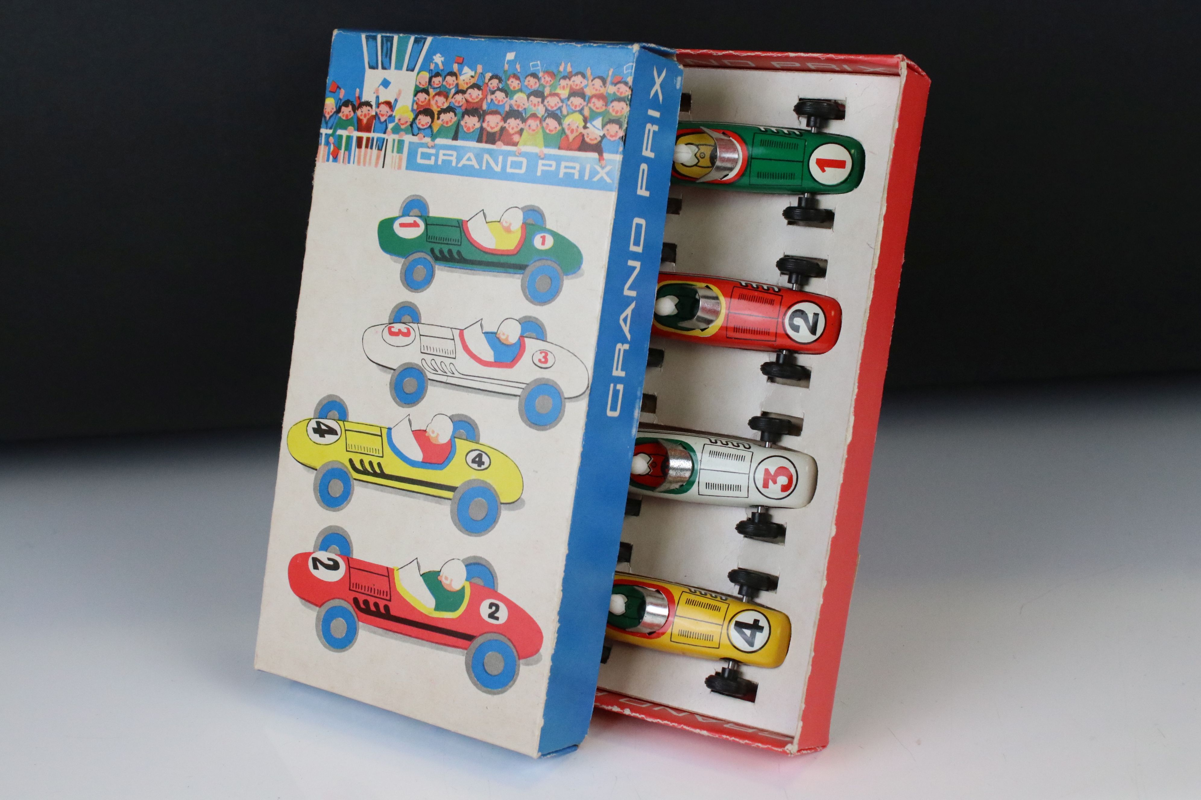 Boxed GDR made tin plate 5012 Grand Prix set of 4 x racing cars, features yellow, red, white & green