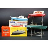 Sutcliffe Boats shop display stand plus a boxed Sutcliffe Victor clockwork motor torpedo boat (