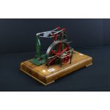 Stuart Turner Beam Stationary Engine in main body green, on wooden base, 14.5 x 9"