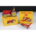 Boxed Dinky 300 Massey-Harris Tractor diecast model in red with driver, plus a boxed 322 Disc Harrow
