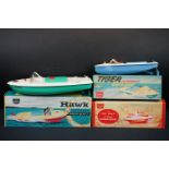 Three boxed Sutcliffe clockwork metal boats to include Hawk in light green & white, Tiger Speed Boat