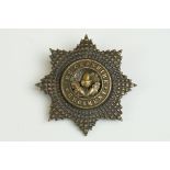 A British The Cheshire Regiment Bronzed OSD Two Piece Cap Badge Complete With Twin Blade Fixings