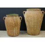 Provincial pottery baluster twin handled vase & another similar, largest 41cm high