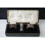 Cased George V silver three-piece condiment set of pierced design, Birmingham 1923, makers