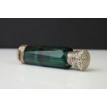 Victorian lady's double-ended faceted green glass scent bottle, with white metal mounts embossed