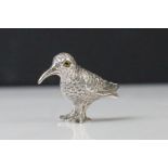 Silver figure of a kiwi bird, with glass eyes