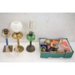 Three Victorian Oil Lamps, one brass with opaque shade, one with green glass well and brass base and