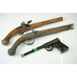 Two modern reproduction flintlock pistols, unmarked, together with a T.J.Harrington & Son 'The Gat