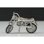 Silver model of a Norton motorcycle