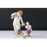 Continental Porcelain Figure of a Boy playing a Musical Instrument, Meissen style blue cross