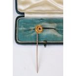 Victorian 15ct Gold Stick Pin, the head inset with a Ruby, stamped 15ct, 6cm long, with case