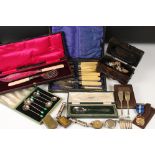 A box of mixed collectables to include police whistles, silver plated cutlery, award medal, brass