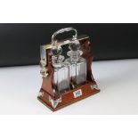 Early 20th century Mahogany and Silver Plated ' Betjamann's Patent ' Two Bottle Tantalus, stamped to